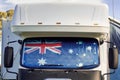 Motorhome campervan with flag of Australia on the windscreen at the campground. Australian camping and travel lifestyle concept