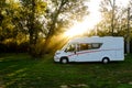 Motorhome campervan on a green landscape camping