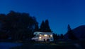 Motorhome on campsite at night. Can use for summer or holiday co Royalty Free Stock Photo