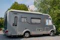 Motorhome with satellite dish raised. Roof mounted and auto searching system. Royalty Free Stock Photo