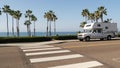 Motorhome trailer or caravan for road trip. Ocean beach, California USA. Camper van, RV motor home.