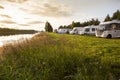 Motorhomes parked at a river in Sweden. Royalty Free Stock Photo