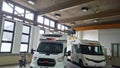 Motorhomes in a hall or large garage