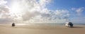 Motorhomes on a sandy beach