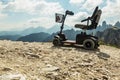Motorised wheelchair for disposable people, Mobile electric buggies on the mountain, Dolomites, Italy. Royalty Free Stock Photo