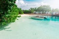 Motorized boat at transparent water at tropical island