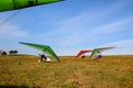 Motorized gliders stand on the ground against of a blue sky Royalty Free Stock Photo