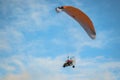 The motorized hang glider in the blue sky Royalty Free Stock Photo