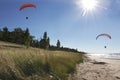 Motorized Hang Glider Kites Flying Over Secluded Beach Royalty Free Stock Photo