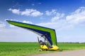 Motorized hang glider over green grass Royalty Free Stock Photo