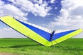 Motorized hang glider over green grass Royalty Free Stock Photo