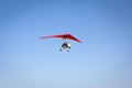 Motorized hang glider soaring in the blue sky Royalty Free Stock Photo