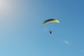 Motorized paraglider flies in the blue sky, extreme sports Royalty Free Stock Photo