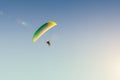 Motorized paraglider flies in the blue sky, extreme sports Royalty Free Stock Photo