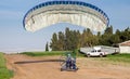 Motorized paraglider just landed on the ground Royalty Free Stock Photo
