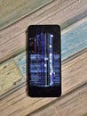 Motorola smartphone with broken screen  -  color and image distorsion Royalty Free Stock Photo
