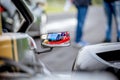 Motorsport car driver detail on rear view mirror