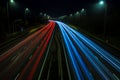 Motorway fast traffic light trails at night Royalty Free Stock Photo