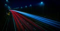 Motorway fast traffic light trails at night Royalty Free Stock Photo