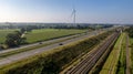 Motorway with few cars and railroad next to it, near the exit of Brecht in Belgium, Europe.