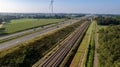 Motorway with few cars and railroad next to it, near the exit of Brecht in Belgium, Europe.