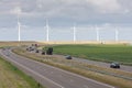 Motorway with a line of windturbines behind it