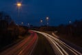 Motorway with Ramp at Dusk with Car Lights Royalty Free Stock Photo