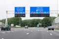 Motorway A1 with traffic and route signs, Amsterdam, Netherlands Royalty Free Stock Photo