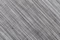 Mottled grey synthetic fabric woven in different tones of grey