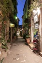 Narrow street with flowers in the old town Mougins in France. Ni Royalty Free Stock Photo