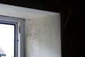 Mould and rot on plastic window frame and cement wall Royalty Free Stock Photo