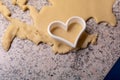 Moulds, hearts, flour and dough for Christmas biscuits