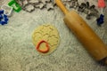 Moulds, hearts, flour and dough for Christmas biscuits