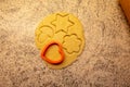 Moulds, hearts, flour and dough for Christmas biscuits Royalty Free Stock Photo