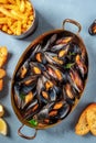 Moules frites, Belgian mussels with French fries Royalty Free Stock Photo