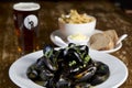 Moules mariniere and fries in a pub Royalty Free Stock Photo