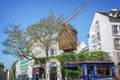 Moulin de la Galette, famous restaurant and old wooden windmill in Montmartre, Paris France