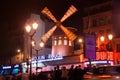 The Moulin Rouge by night in Paris, France. Moulin Rouge is a famous cabaret built in 1889, locating in the Paris red