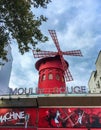 Moulin Rouge windmill against a cloudy summer sky, Paris Royalty Free Stock Photo