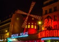Moulin Rouge is the world famous cabaret in Paris at Montmartre. A very effective night light and rotating blades of the windmill