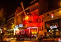 Moulin Rouge is the world famous cabaret in Paris at Montmartre. A very effective night light and rotating blades of the windmill