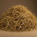 A mound of dry hay is stacked against a plain background. The hay is a mix of thin, Royalty Free Stock Photo