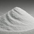 A mound of fine white powder is highlighted against a gray background. The texture Royalty Free Stock Photo