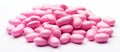 A mound of magenta candies on a white backdrop, a sweet confectionery treat Royalty Free Stock Photo
