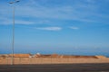 A mound of red sand on a blue sky background Royalty Free Stock Photo