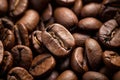 A mound of rich, aromatic roasted coffee beans, ready to be ground and brewed into a flavorful cup of coffee, Close-up detail of Royalty Free Stock Photo