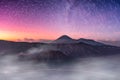 Mount active volcano, Batok, Bromo, Semeru with starry and fog a Royalty Free Stock Photo