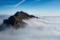 Mount Alben on the Orbie Alps above a sea of clouds Royalty Free Stock Photo