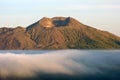 Mount Batur in the clouds at sunrise on Bali Indonesia Royalty Free Stock Photo