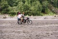 Rider and passenger on motorcycle adventure at Bromo Tengger Semeru National Park Indonesia